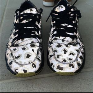 Gucci Brave reflective leopard print shoes .